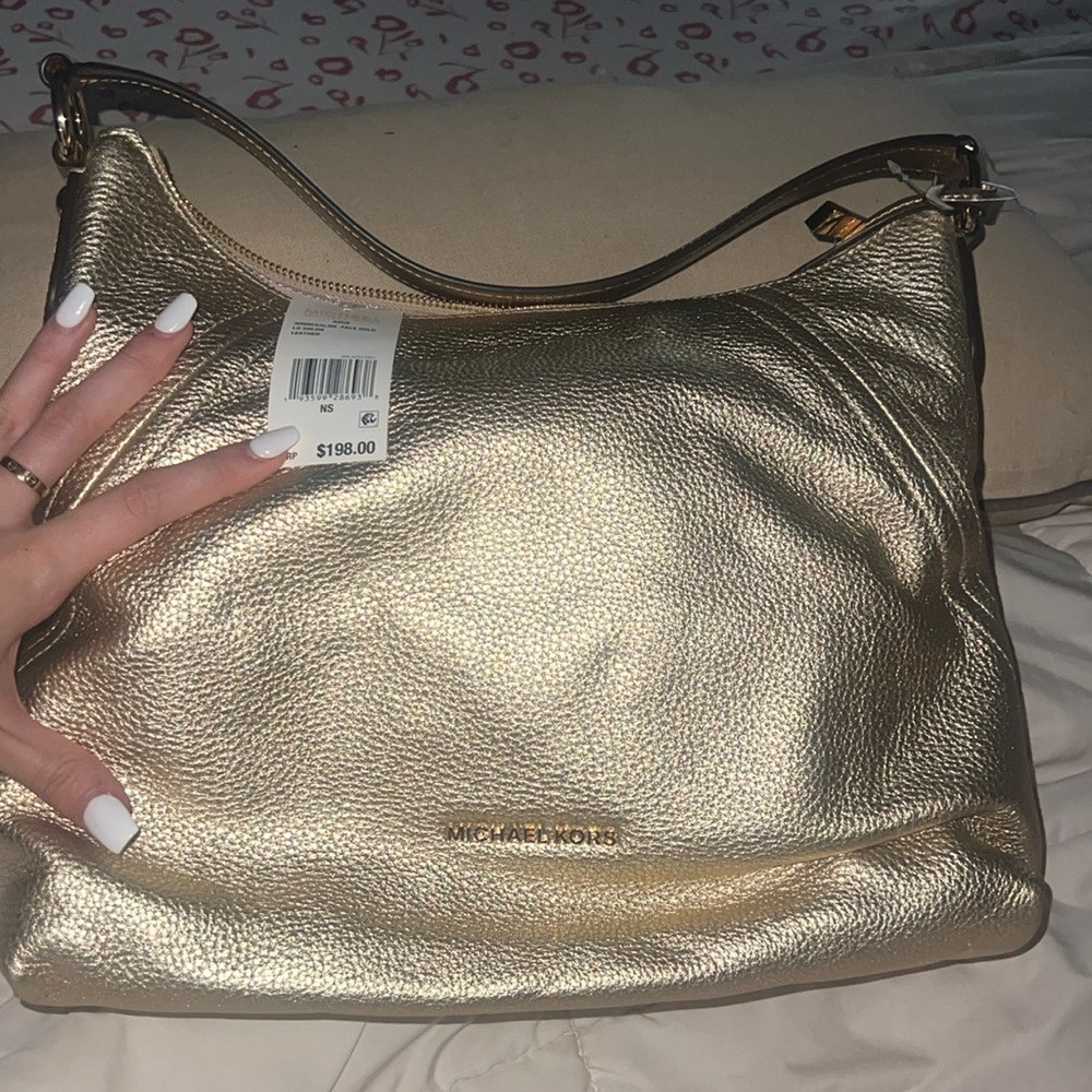 MICHEAL KORS GOLD BAG NEVER USED